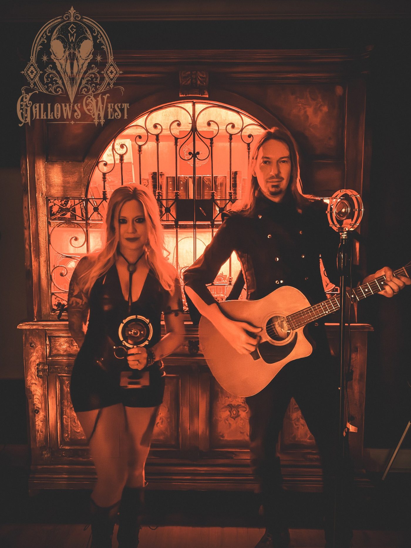 Gallows West duo photo in red light with guitar and vintage microphone